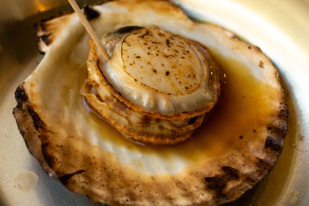 A close up photograph of a shellfish dish.